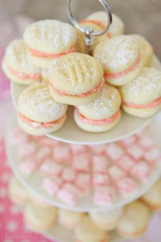 a plate with cookies on it and pink candies in the middle, as well as a keychain