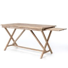 a wooden table sitting on top of a white floor