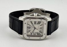 The Cartier Santos was introduced in 1911 and is considered to be the first men’s wristwatch. It was designed by Louis Cartier and named in honour of aviation pioneer Alberto Santos-Dumont, after he wore early prototypes of the watch during his flights. The square case design was unique for the time and the exposed screws around the bezel held the glass in place and were intended to resemble the legs of the Eiffel Tower. Combined with a highly legible dial, it enabled early pilots to quickly rea Cartier Santos 100, Cartier Santos, Patek Philippe Nautilus, Breitling Navitimer, Audemars Piguet Royal Oak, Rolex Day Date, Rolex Gmt, The Eiffel Tower, Rolex Daytona