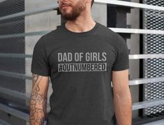 Dad of Girls #outnumbered. The Best Girl Dad Shirt For Fathers Day. Unique Gift For a Girl Dad. Funny Fathers Day Gift For Husband. The perfect Daddy shirt you were looking for! Dada will receive so many compliments with this outfit! This shirt looks great with jeans, shorts, skirt, with a sweater Darkest Dungeon Quotes, Distressed Font, Kimi Raikkonen, Darkest Dungeon, Funny Slogans, Design Lab, Funny Quote, Dad To Be Shirts