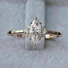 an engagement ring with three diamonds on it