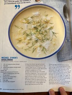 a bowl of soup is sitting on top of a paper with an article about it