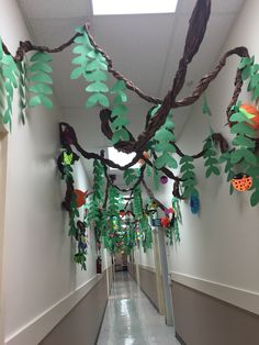 the hallway is decorated with paper leaves and branches