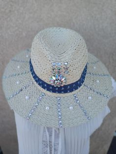 Our straw hats made with love, you saw the rhinestones, pearls with the denim jean wrapped around the hat. Great for a casual gathering with friends.  Measurements of the circumference 22 in. Length and width 14 in. Blue Summer Hat With Rhinestones, Blue Rhinestone Hat For Summer, Summer Hats With Rhinestones And Short Brim, Summer Straw Hat, Painted Hats, Jean Material, Friends Gathering, Straw Hats, White Hat