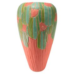 an orange vase with green and pink designs on the outside, sitting against a white background