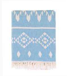 a blue and white blanket with fringes on it