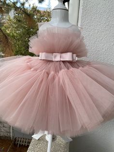 The listing color is Blush! Blush is a medium bright tone of Pink! If your little one is a true pink lover, this dress is totally a dream design for her! It comes with a FREE matching headpiece that is totally adorable. The soft and finest pink tulle meets with a ribbon waist belt on the center, giving the cutest cupcake look to your little one! Skirt has so many tulle layers that makes it a very puffy and fluffy look. An invisible zipper added to the back for the comfort of your little girl. Ca Elegant Tutu Dress With Tulle Skirt For Birthday, Pink Tulle Dress For Party Baptism, Pink Fitted Tulle Baptism Dress, Cute Birthday Princess Dress With Tulle Skirt, Pink Tulle Tutu Dress For Baptism, Sweet Tulle Princess Dress For Birthday, Cute Princess Dress With Tulle Skirt For Birthday, Cute Pink Tutu Dress For Baptism, Cute Pink Tulle Baptism Dress