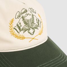 Handcrafted from premium cotton twill, this cap features a classic five-panel design with contrast stitching, peak, and Yacht Club crest. Unlike any cap you've worn before, its thicker, reinforced front panel maintains its shape, while the softer back ensures unmatched comfort. With a pre-curved bill, metal hardware, and adjustable back strap, this limited edition piece sets a new standard for how wearing a cap should feel. Handmade with 100% cotton twill Classic Five-panel design Contrasting Ya Cotton 5-panel Trucker Hat With Embroidered Logo, Green Embroidered 5-panel Baseball Cap, Green 5-panel Baseball Cap With Embroidered Logo, Green Embroidered Logo 5-panel Baseball Cap, Cream Cotton Trucker Hat Baseball Cap, Cream Cotton Trucker Hat, Ice Necklace, Hat Cream, Pearl Shop