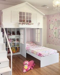 there is a doll house bed in the children's room with stairs to the second floor