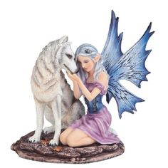 a figurine of a woman and a wolf