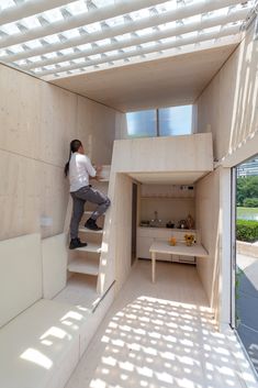 a person climbing up some stairs in a house