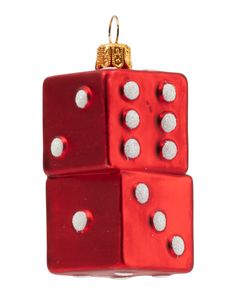 red dice ornament with white dots hanging from it's side on a white background