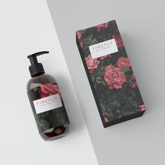 a bottle of hand soap next to a box with flowers on it and the label for freely