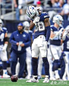 a football player standing on top of a field