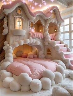 a bed made to look like a fairy castle with pink and white bedspreads