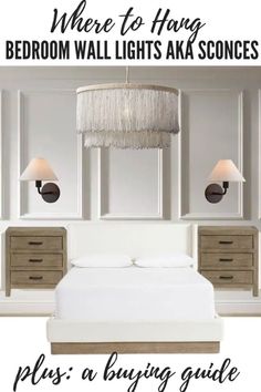 a bedroom with white walls and wooden furniture, including a chandelier above the bed