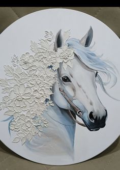 a painting of a white horse with flowers in its mane