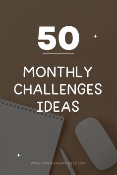 a desk with a mouse, keyboard and notebook on it that says 50 month challenge