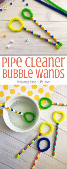 a bowl filled with pipe cleaner bubble wands on top of a white wooden table