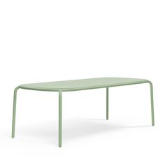 a green table sitting on top of a white floor