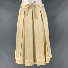 Chloe Circle Skirt Comes In A Beige Acetate And Viscose Sateen Fabric Featuring A Pleated Style, Waistband Belt, And A Center Back Invisible Zip Up Closure. Made In France.Excellent Pre-Owned Condition. Marked: 36 Measurements: Waist: 29 Inches Hip: 46 Inches Length: 25 Inches Sui Generis Reference: 119415 Category: Skirt More Details Brand: Chloe Gender: Female Size: 4 Color: Beige Fabric: Acetate / Viscose Material: Satin Pattern: Pleated Style: Circle Age Group: Adult Sui Generis Designer Consignment Is An Award Winning Fashion Resale Store For Women & Men. Located In San Francisco. The New York Times, Gq, Refinery29, Goop, Forbes And More Have Recogni Pleated Circle Skirt, Resale Store, Box Pleat Skirt, Archive Fashion, Beige Fabric, Summer Design, Box Pleats, Circle Skirt, Gq