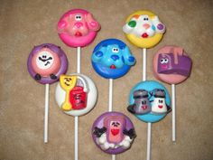 there are many lollipops that have been decorated with cartoon characters on them