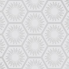 a white and gray hexagonal pattern with sunbursts