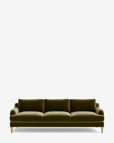 a green couch against a white wall