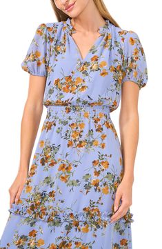 A smocked waist hugs your curves when you slip into this brunch-ready midi dress patterned in soft blooms and trimmed with frothy ruffles. 48" length (size Medium) Slips on over head V-neck Short sleeves Partially lined 100% polyester Machine wash, tumble dry Imported Summer Brunch Midi Dress With Elastic Waistband, Summer Midi Dress With Elastic Waistband For Brunch, Mid-length Ditsy Floral Dress For Brunch, Floral Short Sleeve Dress With Smocked Back For Brunch, Mid-length Floral Print Dress For Brunch, Spring Flowy Floral Dress With Ruched Detail, Flowy Ruched Floral Dress For Spring, Casual Floral Dress With Smocked Bodice For Spring, Casual Floral Dress With Smocked Back For Brunch