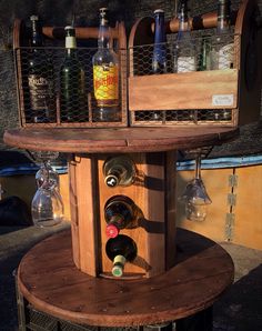 a wine rack with bottles and glasses on it