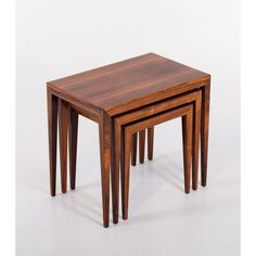 three wooden tables stacked on top of each other