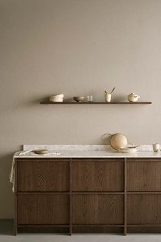 a counter with bowls and cups on it