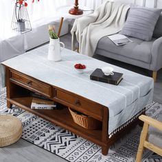 a living room scene with focus on the coffee table and storage drawers in the center