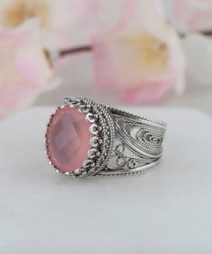 Authentic Aqua or Pink Chalcedony Silver Cocktail Ring,925 Sterling Silver Blue Pink Genuine Gemstones Artisan Crafted Filigree Oval Ring for Women, Jewelry Gifts Boxed for Her The stone measures approximately 10 mm x 12 mm oval and weights approximately 4 carat. Ring Face Length: 0.60 inch Ring face width: 0.50 inch Sizes 5-12 It is like all our jewelry nickel free. This ring will come in a designer pouch, put in gift box and a romance card. Free Shipping It is a gift that will create memories Oval Cabochon Rings With Intricate Design For Gift, Oval Cabochon Jewelry With Intricate Design For Gift, Adjustable Oval Jewelry With Intricate Design, Ornate Pink Jewelry For Gifts, Ornate Pink Jewelry Gift, Blue Sterling Silver Filigree Ring With Gemstone, Antique Filigree Cabochon Ring Gift, Silver Oval Cabochon Chalcedony Jewelry, Unique Cabochon Chalcedony Ring