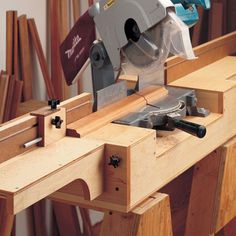 a table saw is being used to cut wood