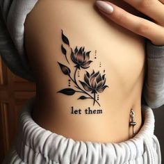 a woman with a tattoo on her stomach that says let them