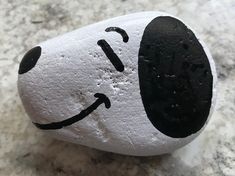 a rock with a face painted on it