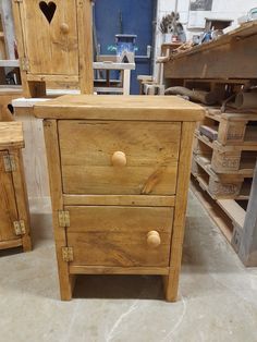 two wooden furniture pieces sitting on top of each other