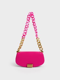 Summer is the season to experiment with bold colours. Let our Sonnet shoulder bag in vibrant fuchsia-pink be the perfect statement accessory to take your OOTDs to new fashion heights. The chunky two-tone chain, curved elongated silhouette and metallic turn-lock closure make this bag a standout piece. Bonus points for its compact interior which ensures enough space for all of your daily essentials. Take this stunner to your next beach party as you match it with a bikini set, a crochet cover-up Pink Shoulder Bags, Canvas Sandals, Crochet Cover Up, Charles Keith, Leather Pattern, Online Shopping For Women, Ladies Party, Metallic Leather, Beach Party