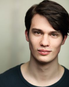 a close up of a person wearing a black shirt