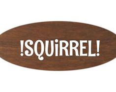 a wooden sign that says,'squirrel'in white letters on a brown background