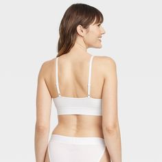 Whether you're donning an outfit to hit the town or just getting dressed to watch TV and relax, the Seamless Bralette from Auden™ is a great addition to your look. The seamless design means easy comfort, regardless of what your plans are for the day. Removable cups give you the freedom to wear the piece however you prefer, and the adjustable straps means you can customize them to make the perfect fit. The pullover design makes for easy on/off. Auden™: Comfort true to every shape & hue. Fitted Seamless Bra For Loungewear, Seamless Fitted Bra For Loungewear, Fitted Seamless Loungewear Bra, Stretch Bra With Moderate Coverage, White Stretch Bra With Seamless Design, White Fitted No-show Bra, White Seamless Bra For Loungewear, White Seamless No-show Bra, Stretch Full Coverage Bra For Daywear