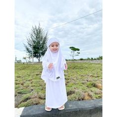 Assalamualaikum mom..  Alhamdulillah  the best seller FK Aisyah Set is now ready again with a new color and ready from a small size too ...  ❤️ Let's teach your little one to wear a headscarf from an early age ❤️ . ️ New FK Aisyah set made of premium jersey material ️Short sleeve loose shirt with Japanese zipper on the back  ️The khimar blends with the arm and can be used as a veil at the same time .  Detail size French Khimar Aisyah Set *size S 1-2 years Bust 30 cm Dress length 60 cm  *size M 2 Traditional White Long Sleeve Khimar, Modest White Khimar For Eid, White Long Sleeve Modest Khimar, Traditional White Hijab For Eid, French Khimar, Baby Girls Dresses, Girls Robes, Loose Shirt, Loose Shirts