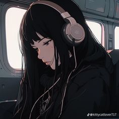 a girl wearing headphones looking out the window on an airplane with her eyes closed