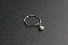 Dainty dangly pearl ring, featuring a white freshwater rice-shaped pearl. Handcrafted with your choice of 14k gold-filled, sterling silver, or argentium silver wire, catering to sensitive skin. A great choice for minimalist jewelry lovers.   𝑔𝑜𝓁𝒹 𝒻𝒾𝓁𝓁 14k gold fill jewelry is an excellent choice for those seeking both quality and affordability. Crafted by bonding a thick layer of 14-karat gold to a base metal core, it offers the luxurious look of solid gold without the high price tag. Th Silver Pearl Ring, Gold Pearl Ring, Solitaire Rings, Freshwater Pearl Ring, Gold Bond, Gold Filled Ring, Argentium Silver, Ring Minimalist, Minimalist Ring