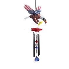 a wind chime with an eagle and american flag on it's back end