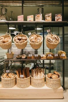 breads and pastries on display in a bakery