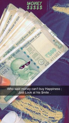 someone holding money in their hand with the caption who said money can't buy happiness just look at his smile