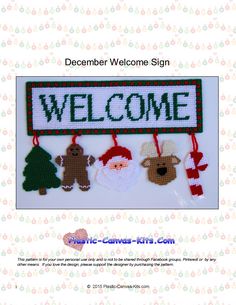 a welcome sign with christmas decorations hanging from it