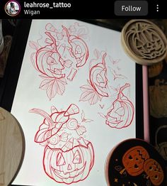 the drawing is being worked on by someone who has drawn pumpkins and other decorations